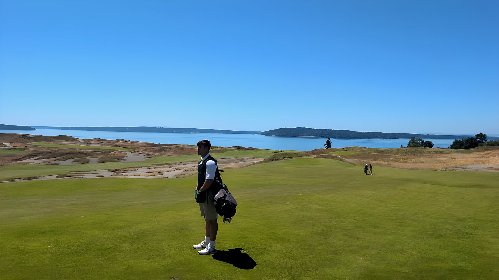 A player overlooking Puget Sound at Chambers Bay